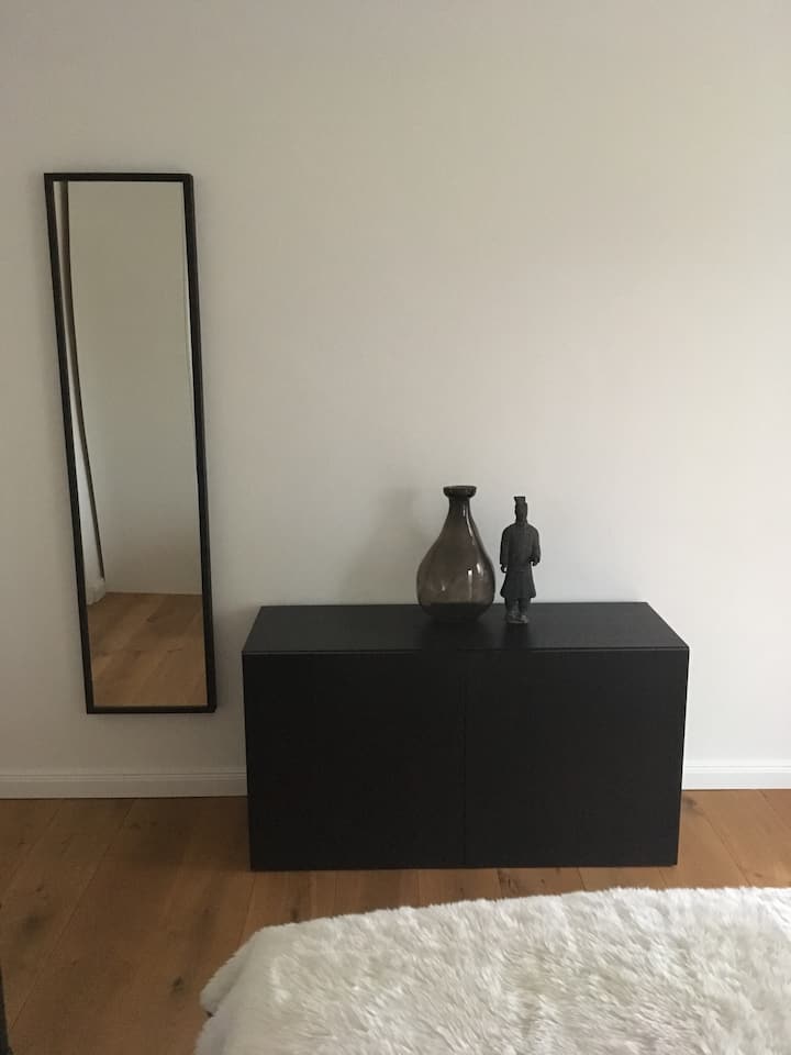 Bedroom Sideboard with iron and children's blanket and cover