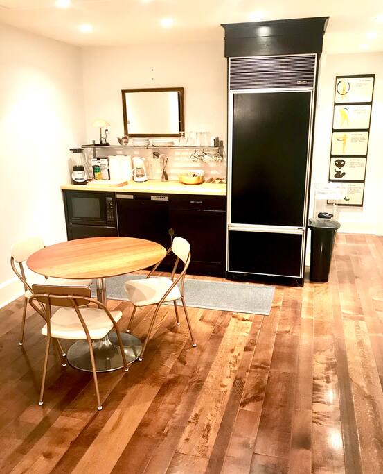 Food prep area includes, a full size refridgerator, a microwave, coffee maker, dishware and other kitchen amenities.