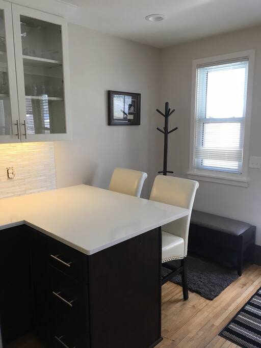 Conversation space and in-kitchen eating area/rear entry "mudroom" space