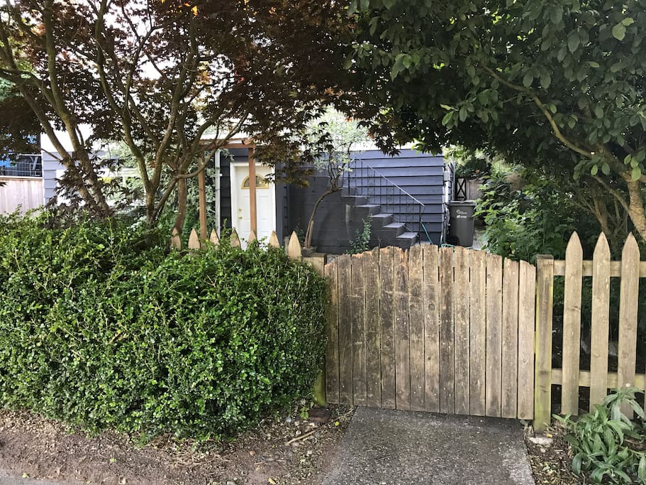 Slightly below-grade (1 step down) basement entry visible on left. Stairs to "main floor" visible to the right of the basement door.
