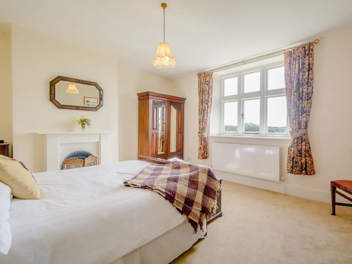Double room with stunning views out across the Cotswolds.  Access to landing and family bathroom.