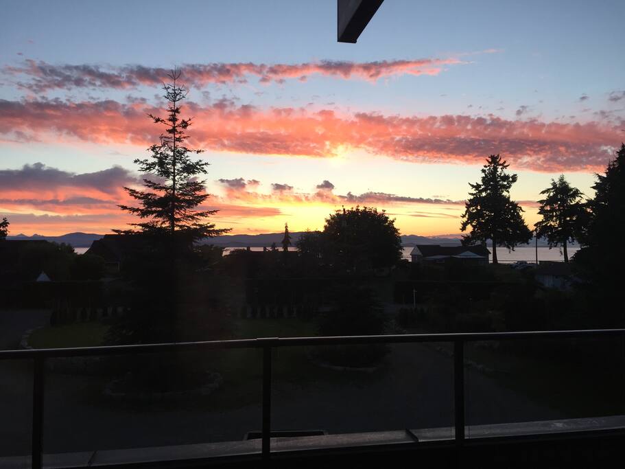 Early morning sunrise from the deck facing ocean and mountains. The best view on the property