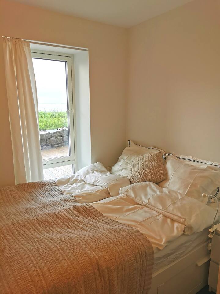 The smaller bedroom also has a double bed and great views of the ocean. 