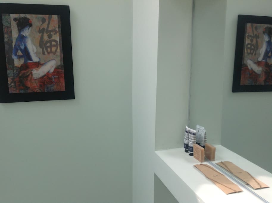 Mirror and amenities in your private bathroom