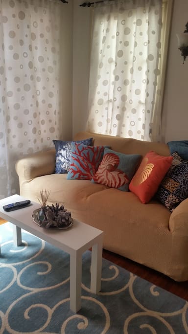 The love seat in the TV area