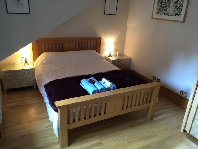 Spacious double room in large open plan apartment.