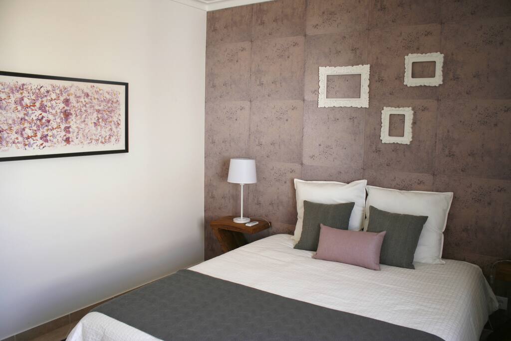 Main bedroom bed and painting