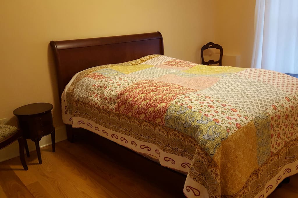 Patchwork room with a private bath attached.