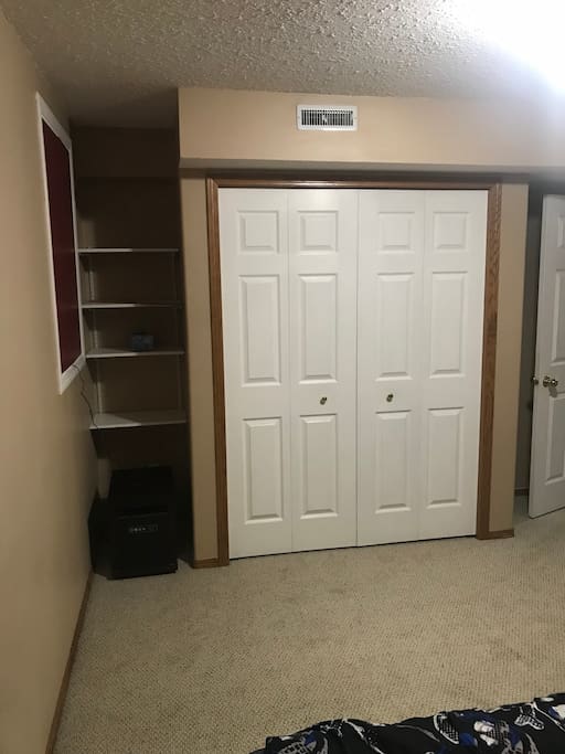 Large closet and shelving, space heater on the floor for those cold nights.