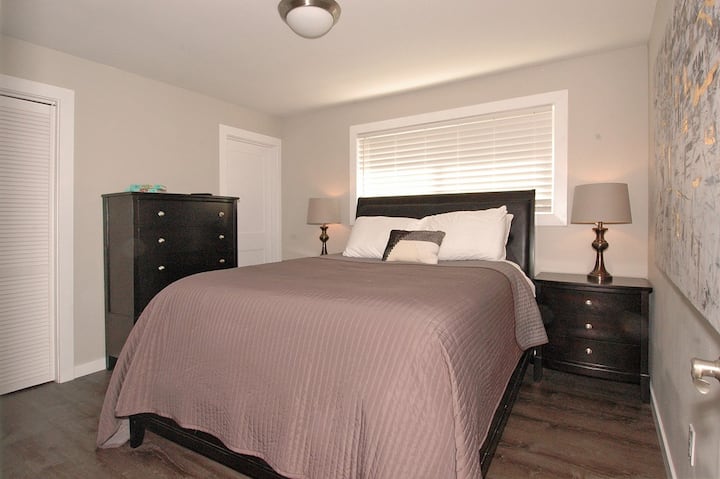 En suite guest bedroom with queen mattress. Not pictured is a 50" Samsung smart TV.
