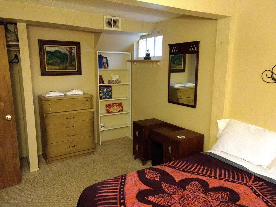 Just another view of the room, crispy white sheets books and games.