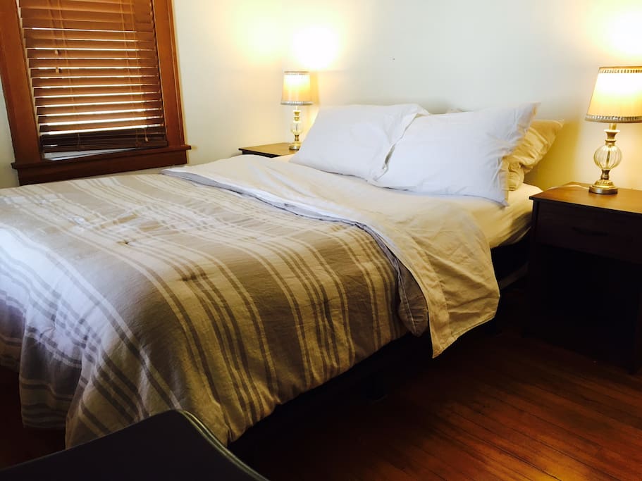 Comfy queen bed with crisp, clean sheets.