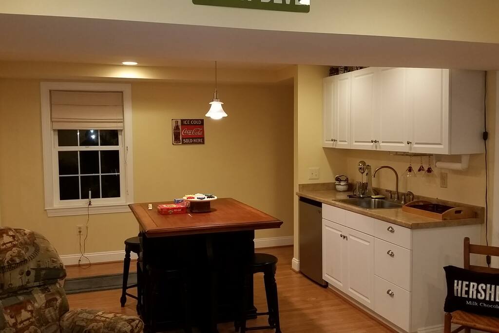 Kitchenette with Mini Fridge, sink, microwave eating table.