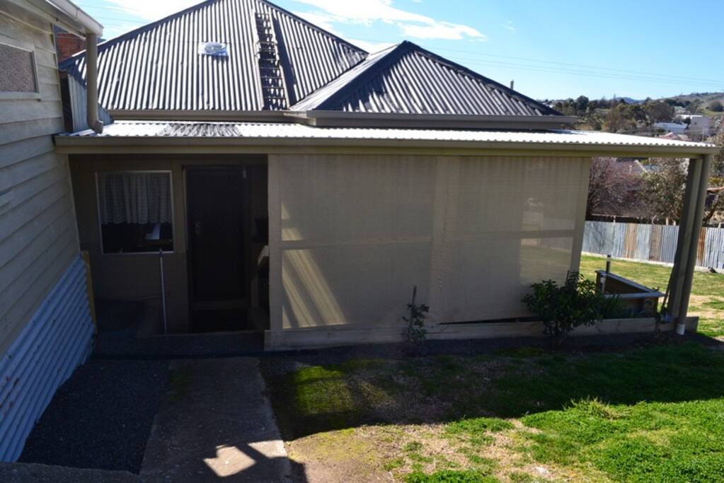 Main entrance at back of house, accessed via street behind Camp Street, where there is a garage for secure parking