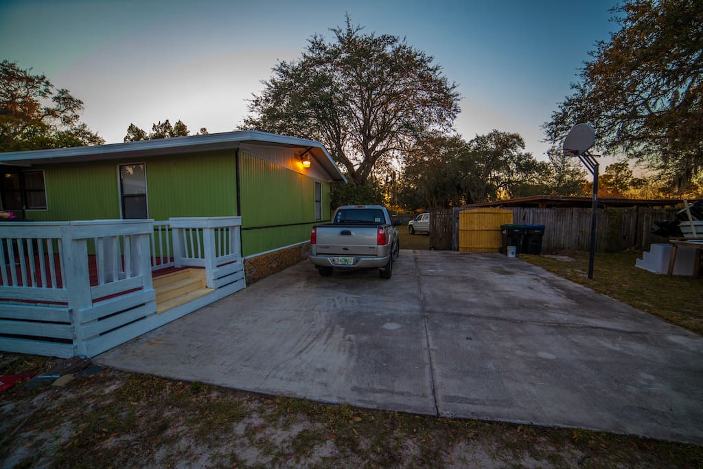 a large paved driveway big enough to fit 4 cars