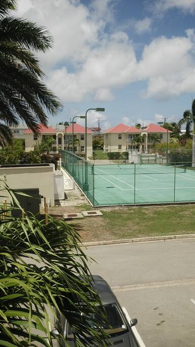 view of tennis court within compund