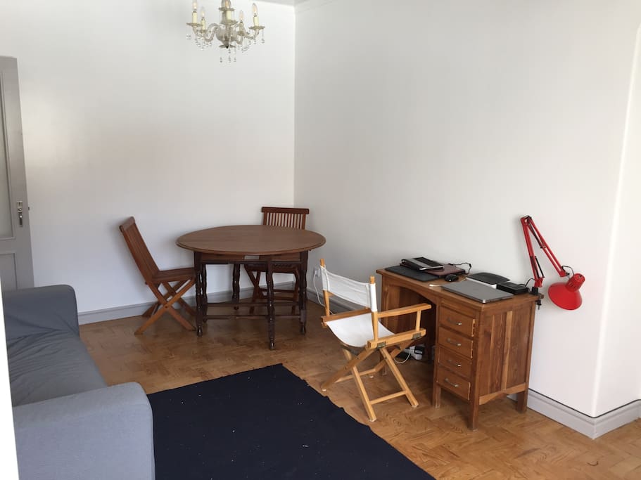 The living space with table and four chairs (2 chairs against the wall). The apartment is equipped with hi speed wi-fi connectivity.