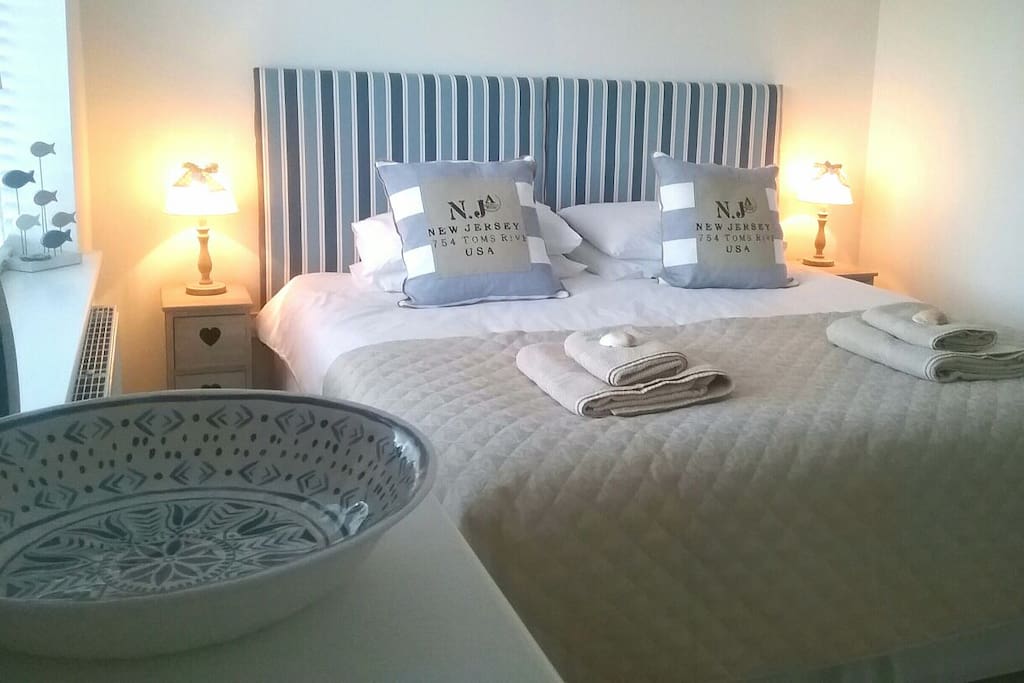 King Size Bed with Bath & Hand towels provided.