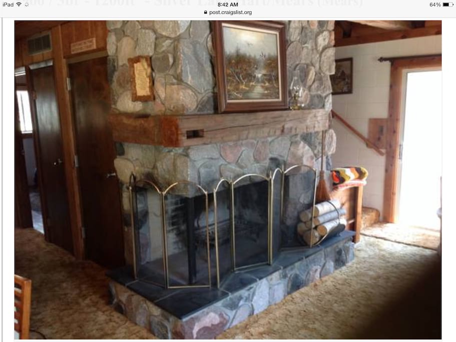 Fieldstone fire place. But unfortunately not to be used; outdoor fire pit is for your use. Wood is for sale in many location around town.