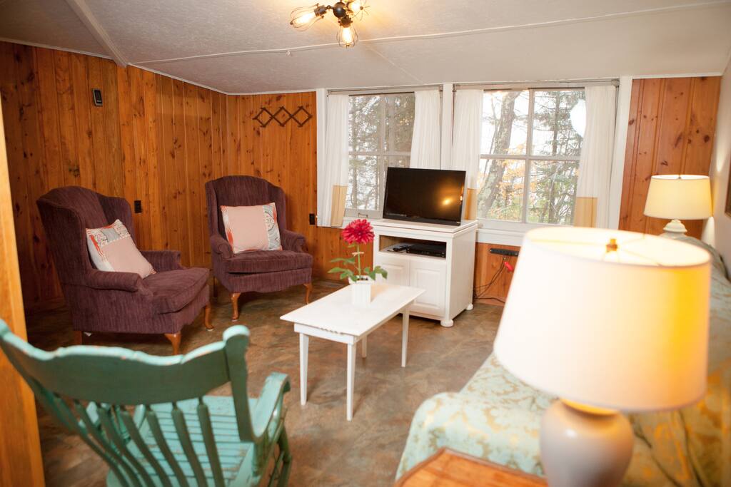 Living room with windows overlooking the lake.