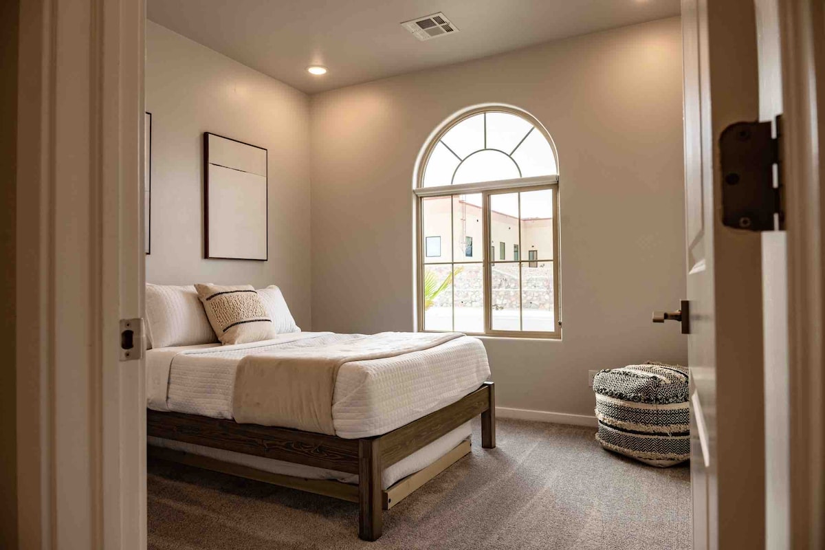 Wide shot of one of the bedrooms in the home. Trundle located under the bed