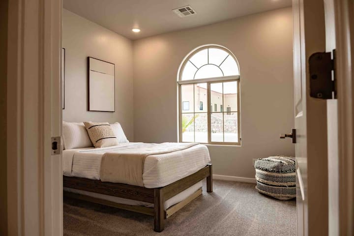 Wide shot of one of the bedrooms in the home. Trundle located under the bed