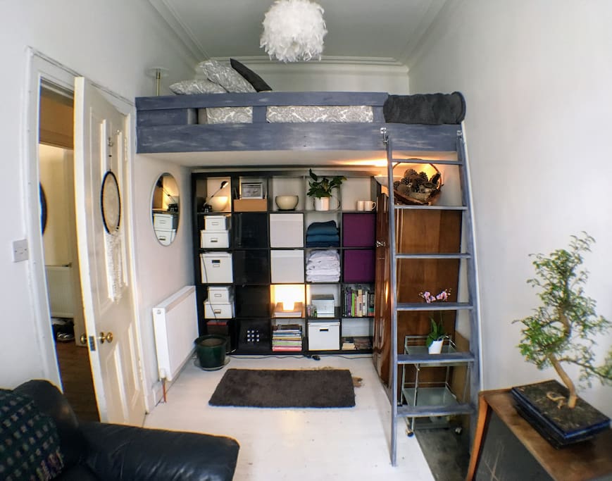 Cosy bedroom with Double Platform Bed and Living Area with Sofa