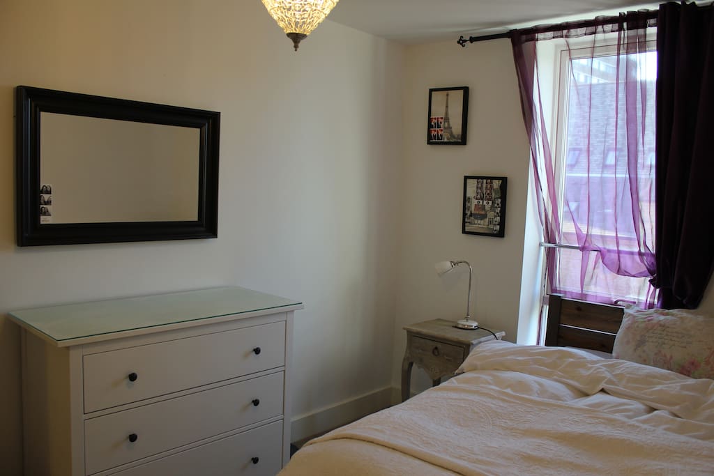 A mirror and chest of drawers for your clothes. There is a double wardrobe in the room as well but it doesn't show in this picture.