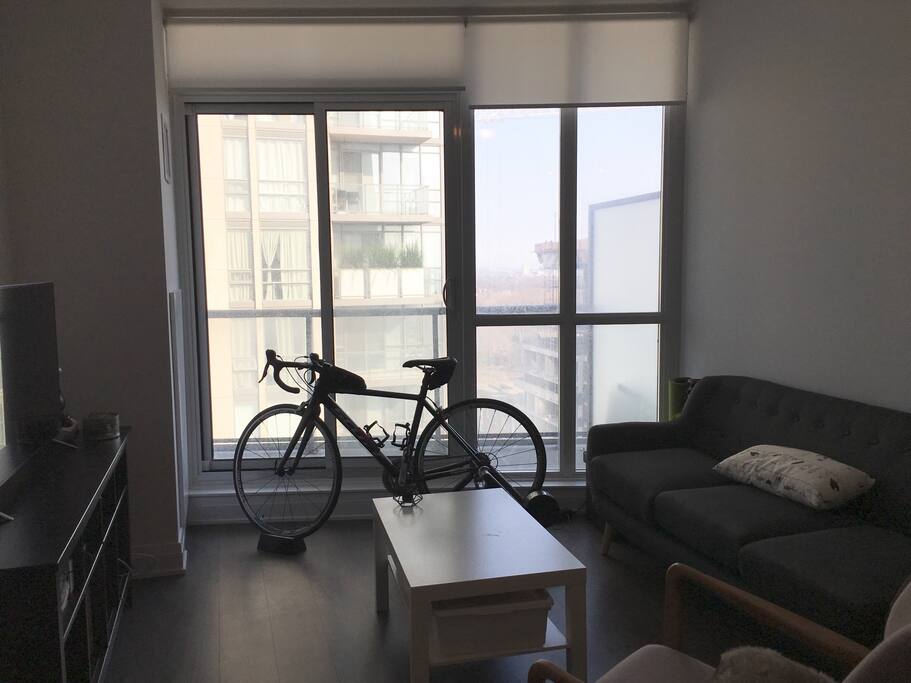 Living room area. Glass windows/doors open out to huge walk out balcony looking East. Gorgeous sunrises!