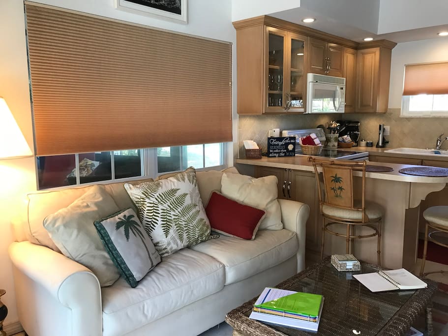 Living room looks out to pool deck