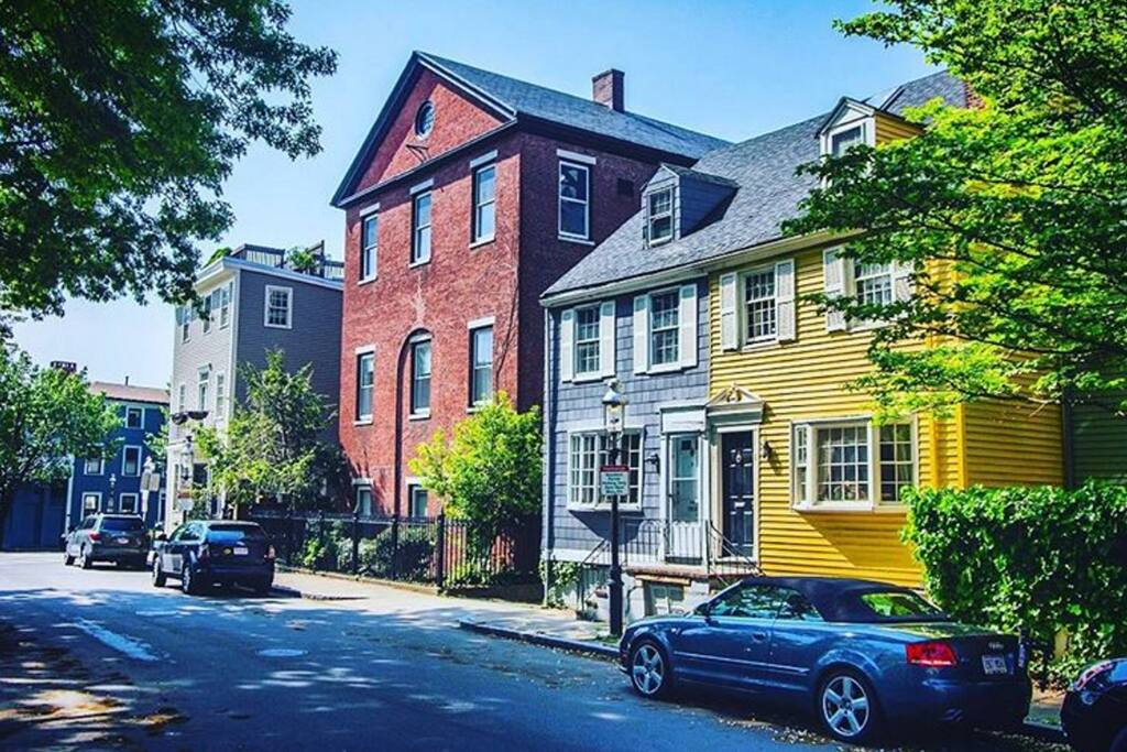 apartment is in this 1820s brick building on the historic training ground field in charlestown