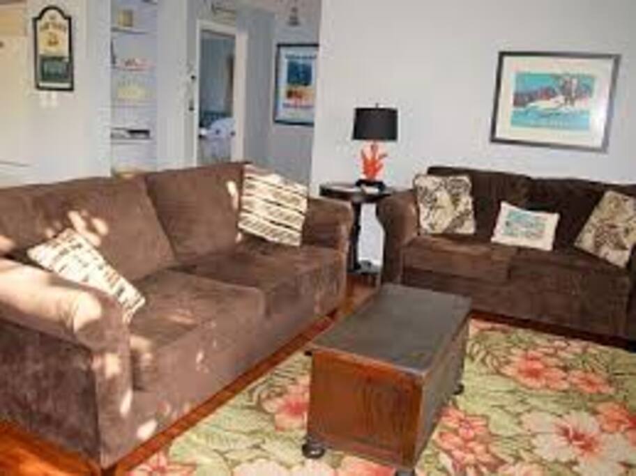 living room with plenty of seating and open floor plan