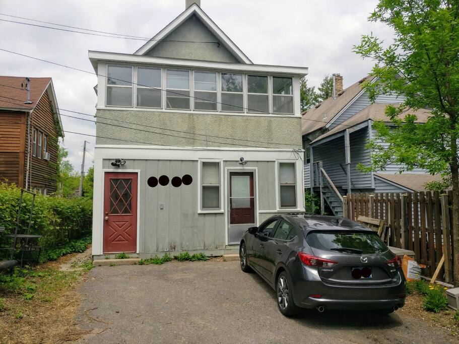 This is the back of the house, as seen from the alley. Two parking spaces, one for each unit. Both are yours when you rent the whole house. Please park all the way over to one side to leave room!