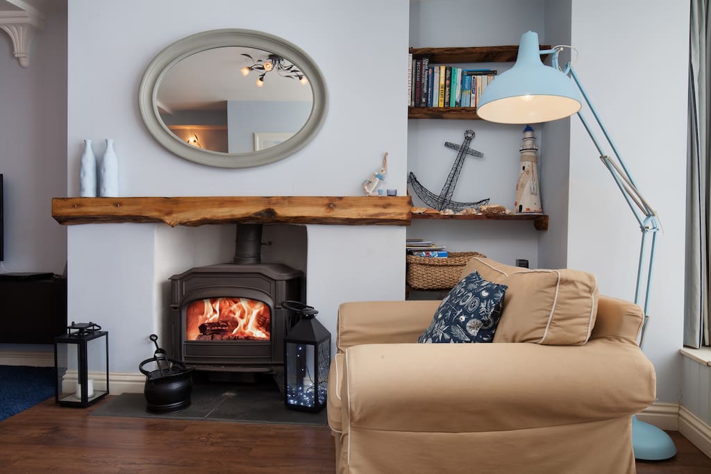 Real log burner at The Hideaway - a cosy pet friendly ground floor apartment in the centre of Shaldon