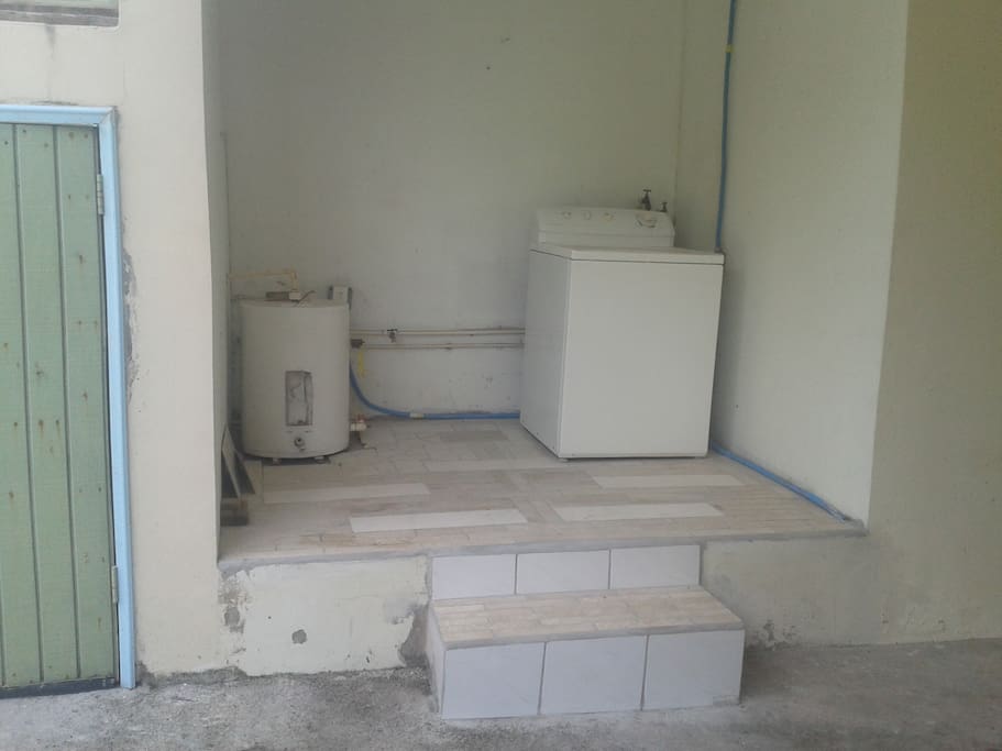 Exclusive laundry area to apartment. Tiles laid by me.