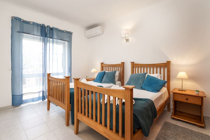 Bedroom (2) with two single beds with bright and sunny balcony and a spacious closet (1st floor).