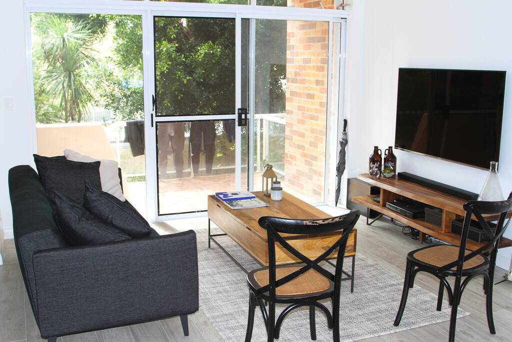 Kick back and relax in the living room after a busy day.
(Proudly note the wet-suit's in the background!)