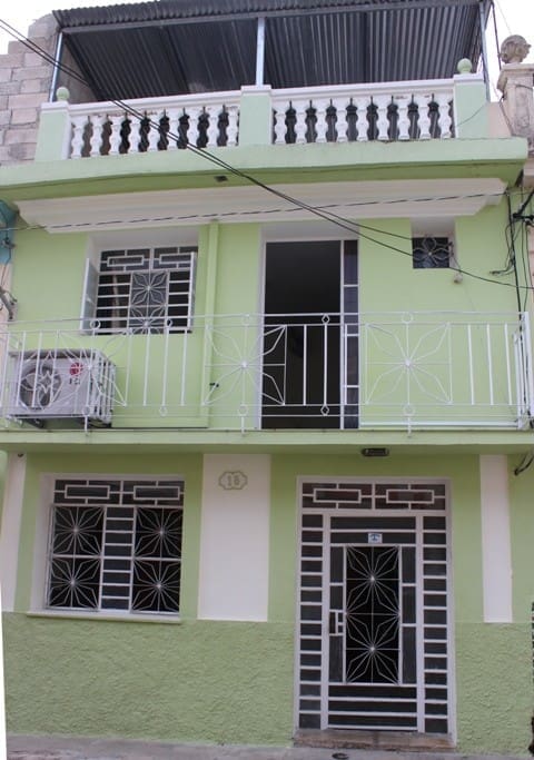 View of the house and the room from the street. The room is located in the 1st floor.