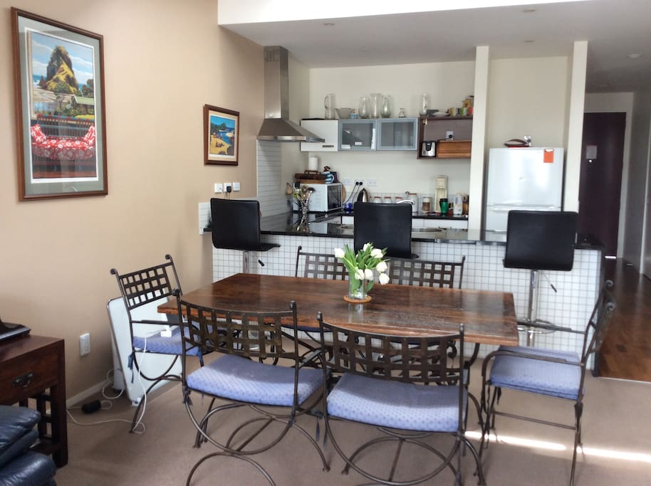Kitchen dining area with breakfast bar and dining table