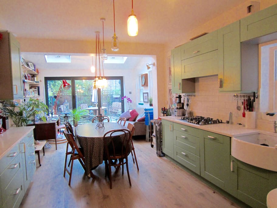 Bright and airy kitchen-dining room with direct access to a private garden