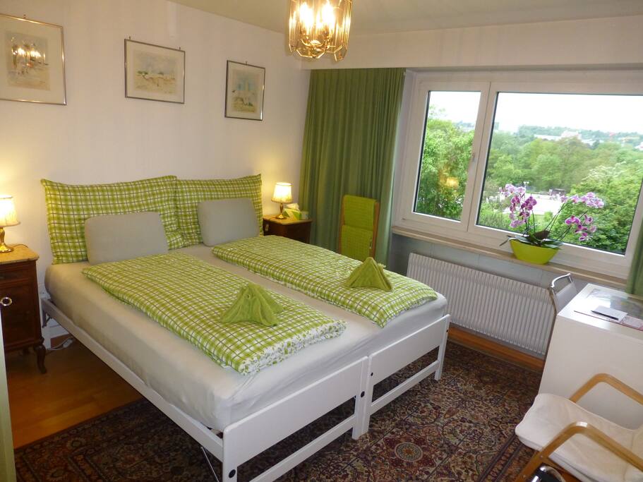 Twin-bed room with view of horse-racing course and St Jakob-Park Basel