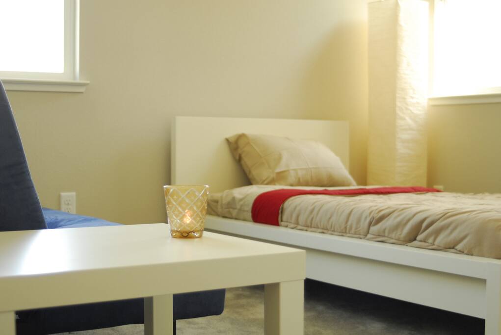 You'll be staying in a fully furnished room with a twin sized bed, lamp, hamper, hangers, body towels, face towels, side table, and spacious closet.