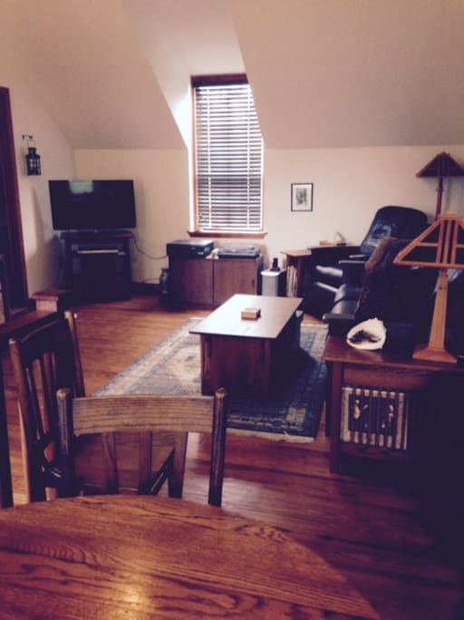 Hardwood floors, natural lighting, unique furnishings.