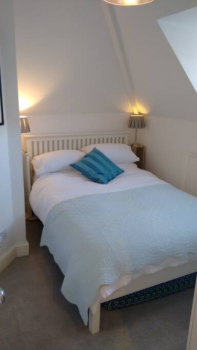 Double bed, John Lewis cupboards and dresser, Flat screen TV.