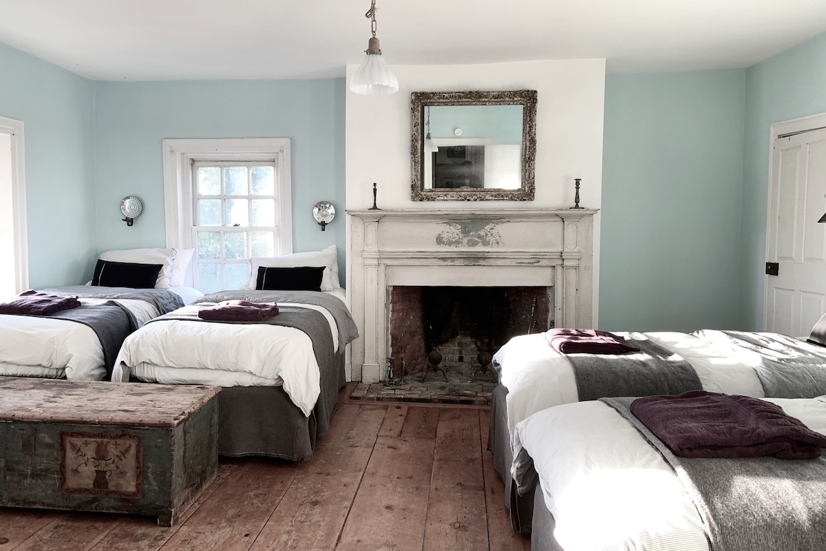 The Blue Bedroom 2 is located upstairs and features 4 twin size beds