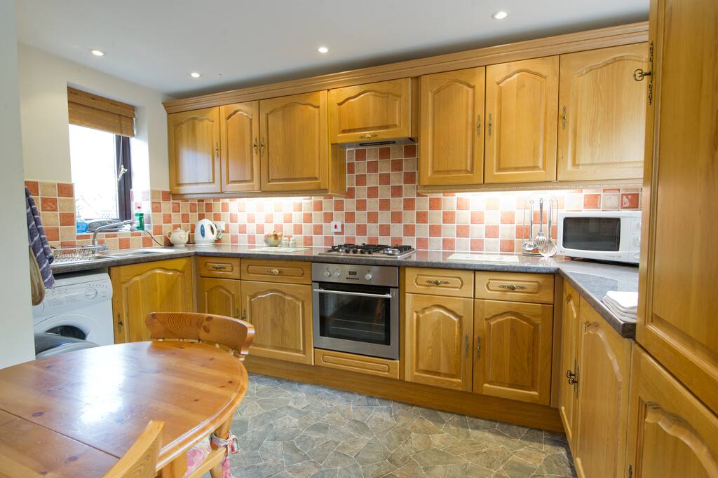 Kitchen/dining area with a dining table large enough to seat 6 people