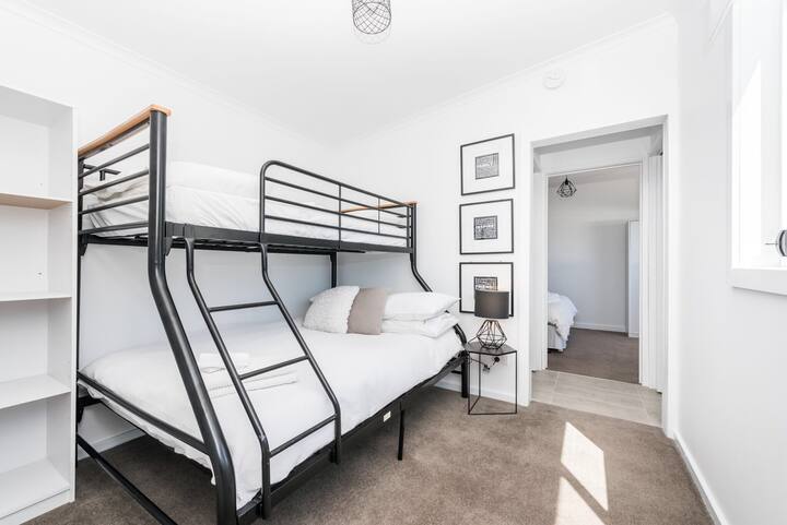 The walk through second bedroom comfortably sleeps 3 guests in a Double bed with Single above. All linen is supplied, is of beautiful quality is crisp & white.....