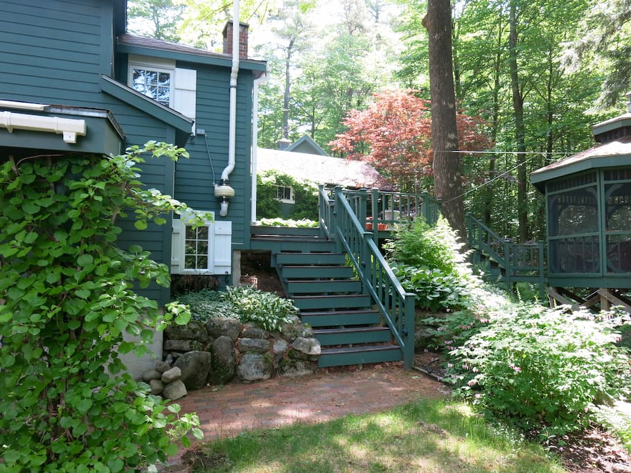 A view from the yard toward the gazebo and side of the house