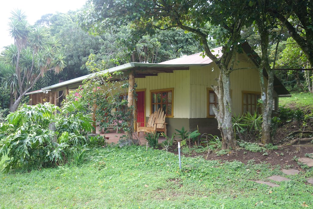 Watch the monkeys, birds, butterflies, and sheep from your spacious front porch.