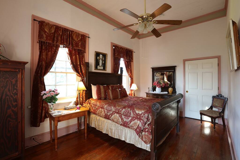 Antique Double Bed with windows overlooking Historic city of St. Martinville and St. Martin de Tours church, 3rd oldest church in Louisiana